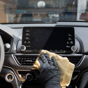 Meguiar's bottle beside microfiber towel indicating refill value and convenience benefit