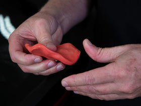Meguiar's clay in use on car panel demonstrating smooth finish and improved surface feel