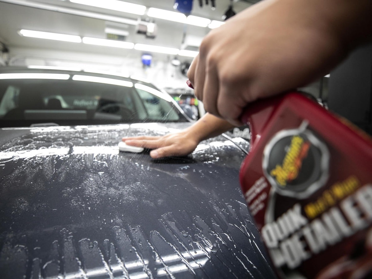 Meguiar's clay bar in use on hood showing smooth finish improvement and ease of use