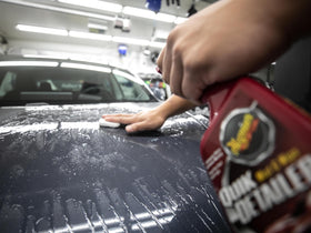 Meguiar's clay bar in use on hood showing smooth finish improvement and ease of use