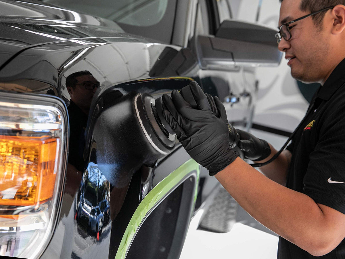 Meguiar's finished car panel reflecting light to show deep gloss benefit