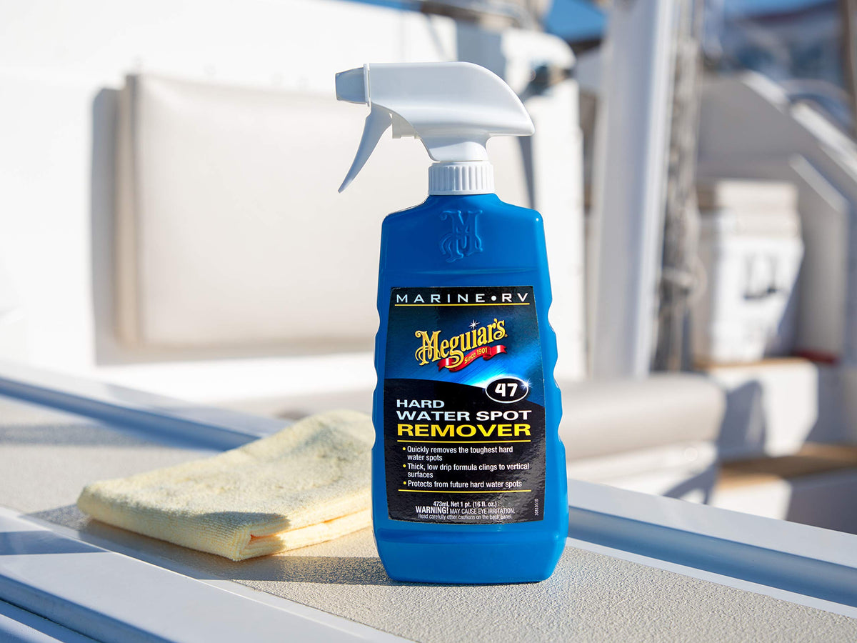 Meguiar's being used on an RV exterior to tackle water spot streaks
