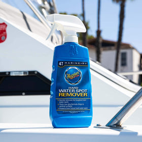 Meguiar's spray being applied to a boat surface for quick spot removal