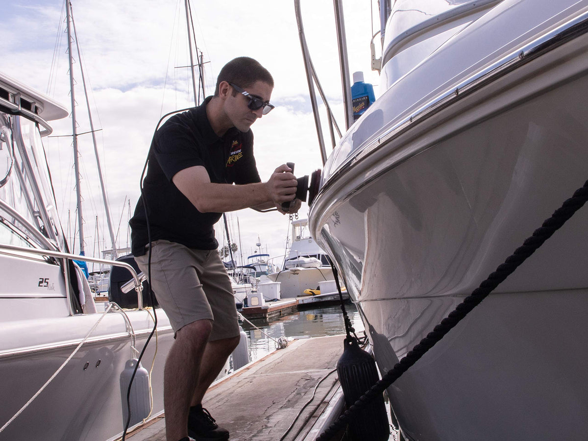 Meguiar's applied with buffer on boat hull demonstrating efficient oxidation removal and restored gloss