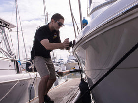 Meguiar's applied with buffer on boat hull demonstrating efficient oxidation removal and restored gloss