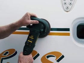 Meguiar's M5016 16 oz bottle next to a hand for scale showing compact, portable maintenance kit