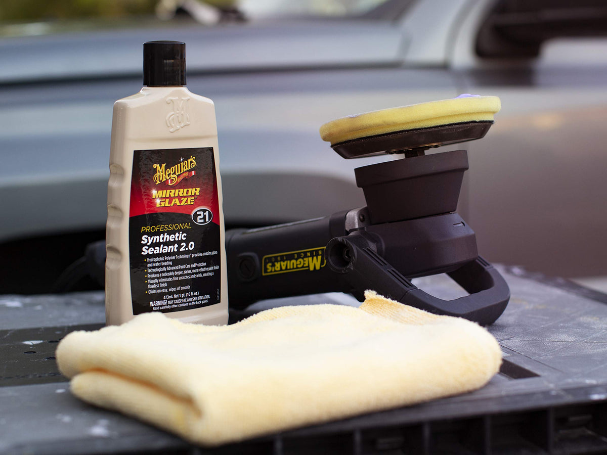 Meguiar's close-up of sealant being wiped for deep gloss benefit