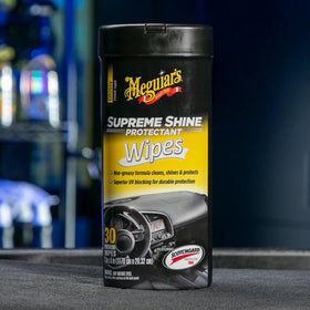 Meguiar's canister placed in glovebox illustrating compact storage benefit