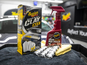 Meguiar's Quik Detailer spray bottle detail demonstrating lubrication for scratch-free claying