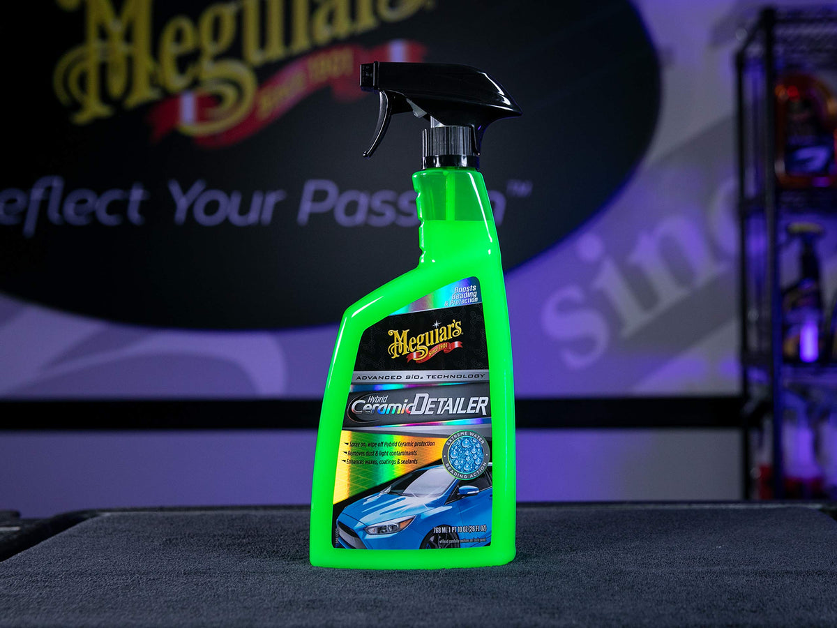Meguiar's water beading on black hood highlighting superior hydrophobicity