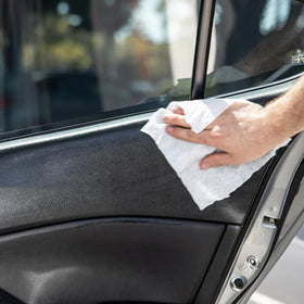 Meguiar's wipe in use on dashboard showing fast cleaning and glossy benefit