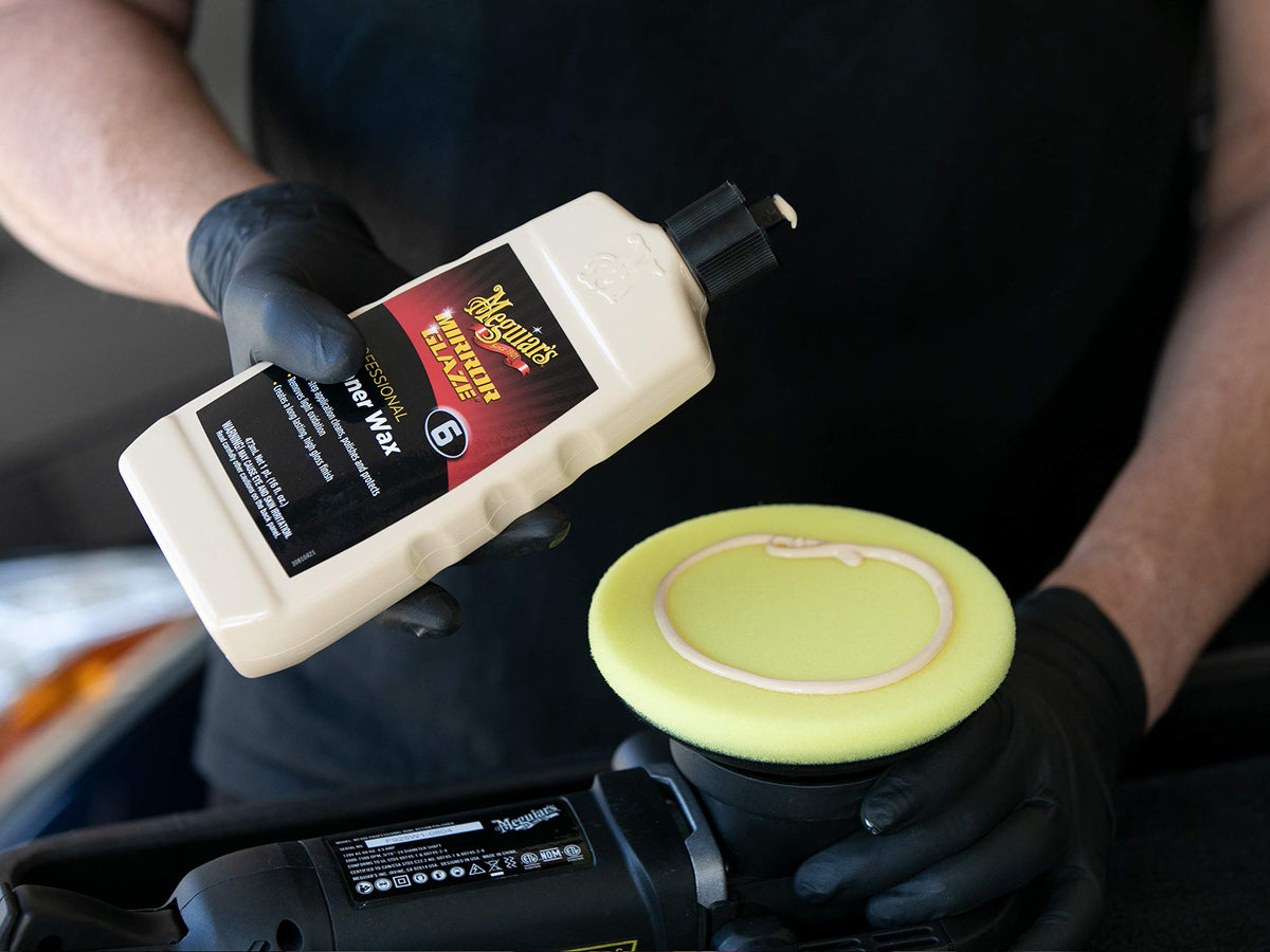 Meguiar's wipe-off demonstration revealing deeper gloss and cleaner surface instantly