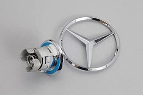Mercedes Benz hood emblem mounting detail with spring clip and blue trim for secure fit