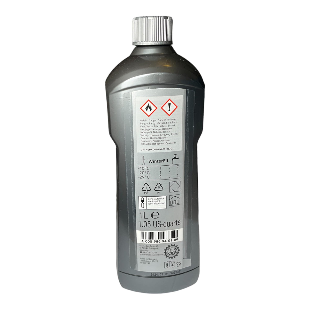 Mercedes-Benz concentrate being poured into washer reservoir showing easy application benefit