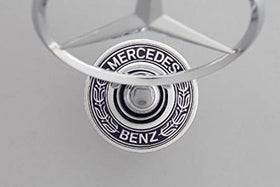 Mercedes Benz C230 hood ornament installed on vehicle showing restored factory appearance
