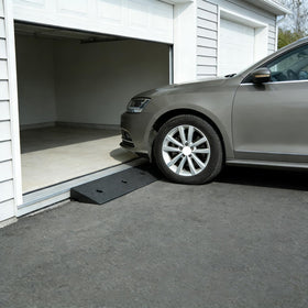 METFUIN ramp mounted on driveway with included bolts for permanent security