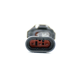 Michigan Motorsports adapter connector close-up showing OEM-style terminals for reliability