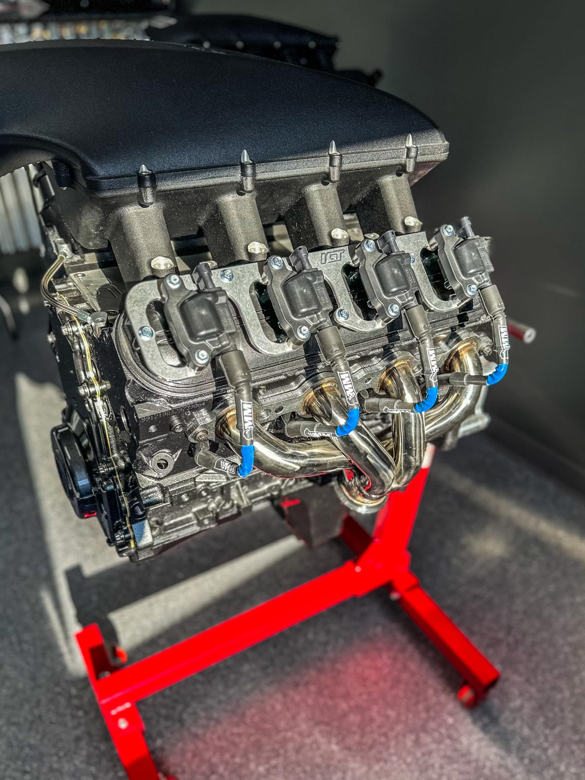 Michigan Motorsports installed in engine bay, demonstrating tidy routing and improved appearance under hood.