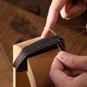 MILD EAST water-resistant demo showing leather repelling light moisture benefit