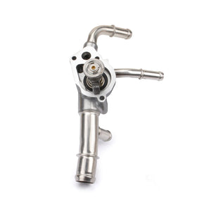 MILIPARTS thermostat housing next to ruler showing compact size and accurate fit