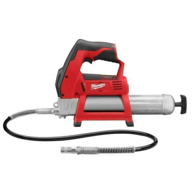 Milwaukee grease gun label and controls showing pressure specs and easy priming