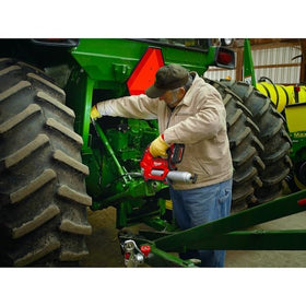 Milwaukee couplers on workshop bench with grease gun showing professional readiness