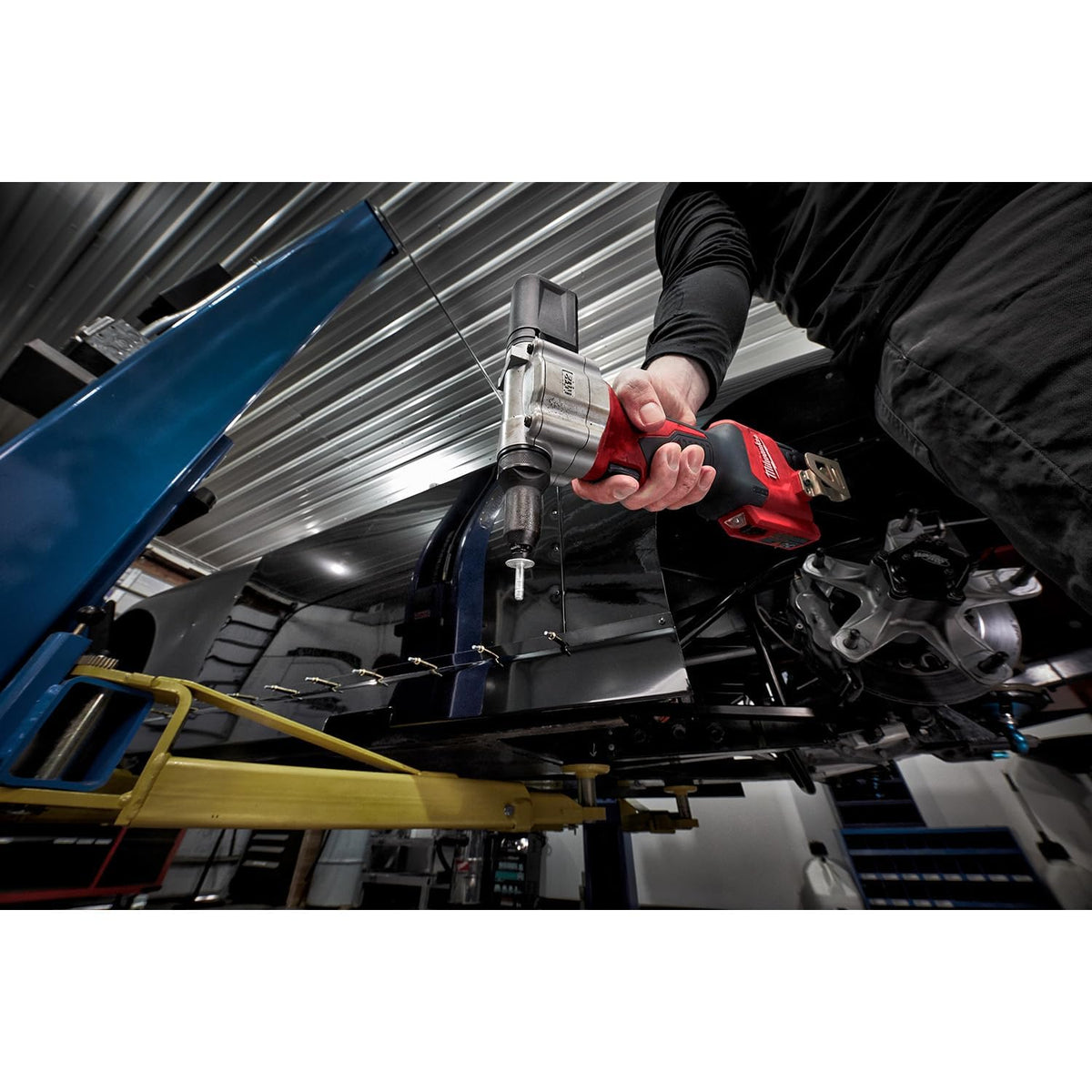 Milwaukee M12 2550-20 installing a rivet into sheet metal illustrating cordless convenience