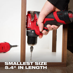 Milwaukee M12 drill and impact on a hand for scale and compact advantage