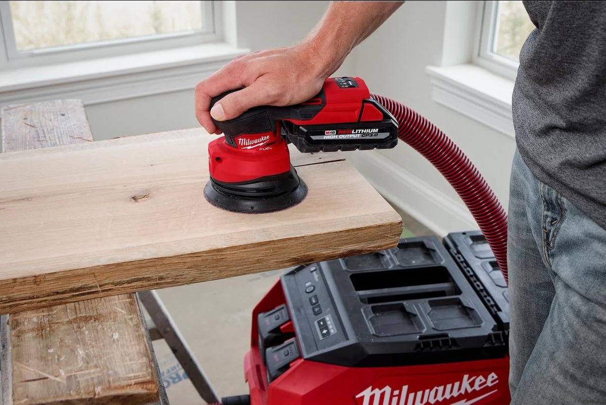 Milwaukee M18 FUEL sander grip ergonomic detail for reduced operator fatigue