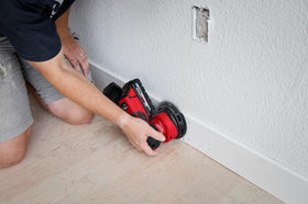 Milwaukee M18 FUEL sander in use on wood demonstrating fast material removal