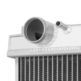 Mishimoto radiator installed under hood showing bolt-in, no-cut fit