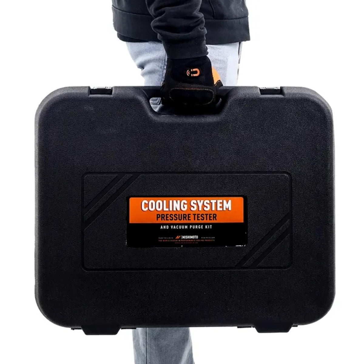 Mishimoto kit held in hand to show scale and portability for garage use