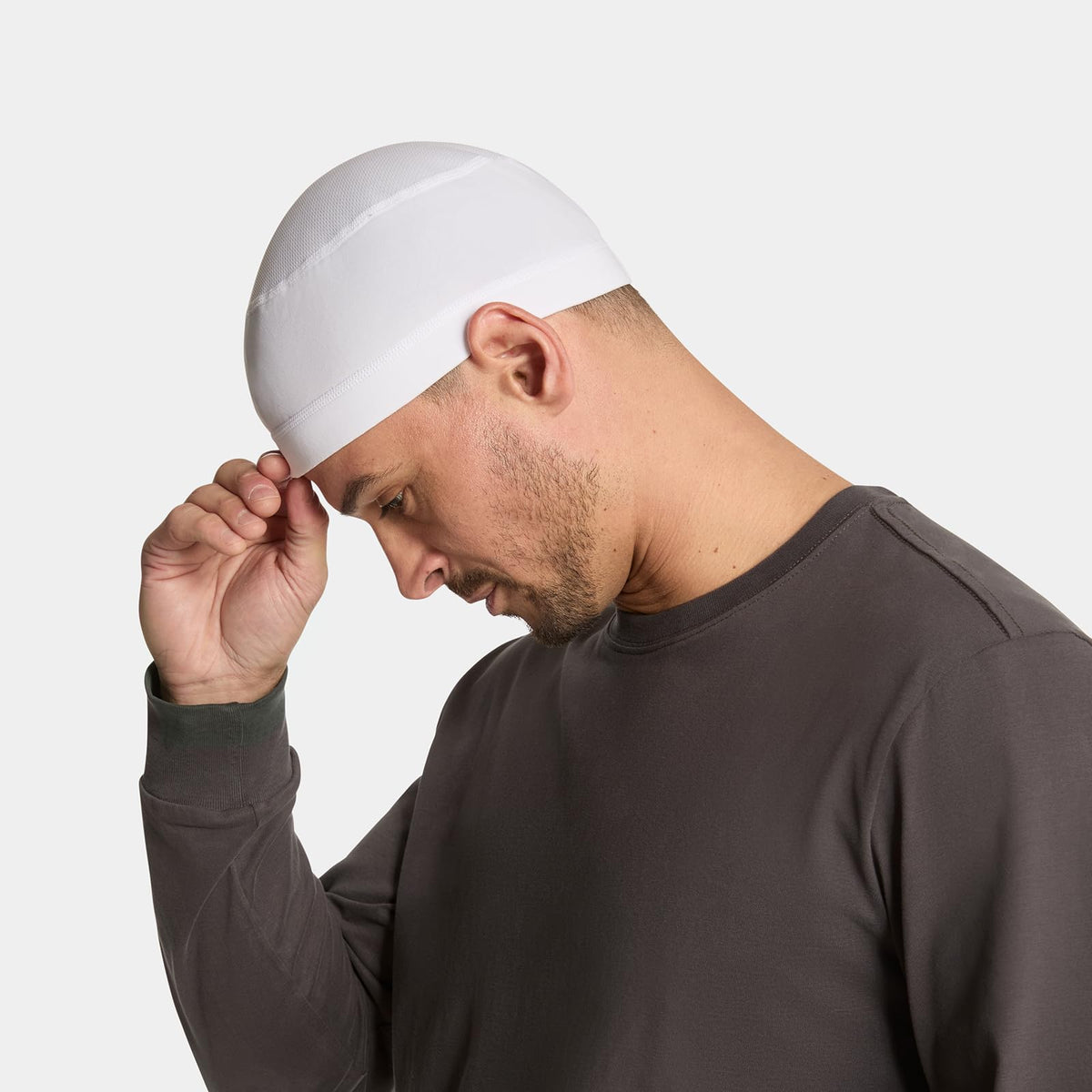 MISSION helmet liner worn by runner outdoors providing cooling and sun protection