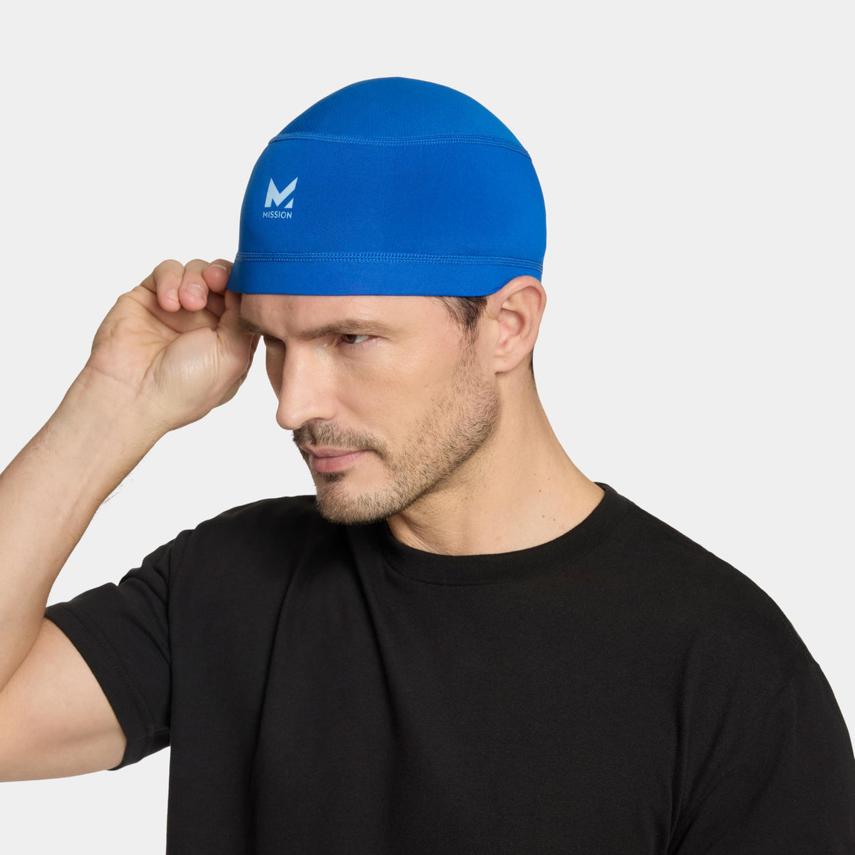 MISSION liner folded in back pocket showing compact portability benefit