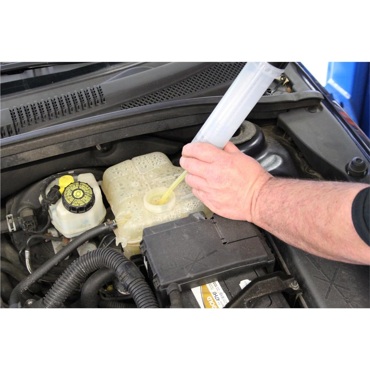Mityvac dispensing power steering fluid into a rack without overfill