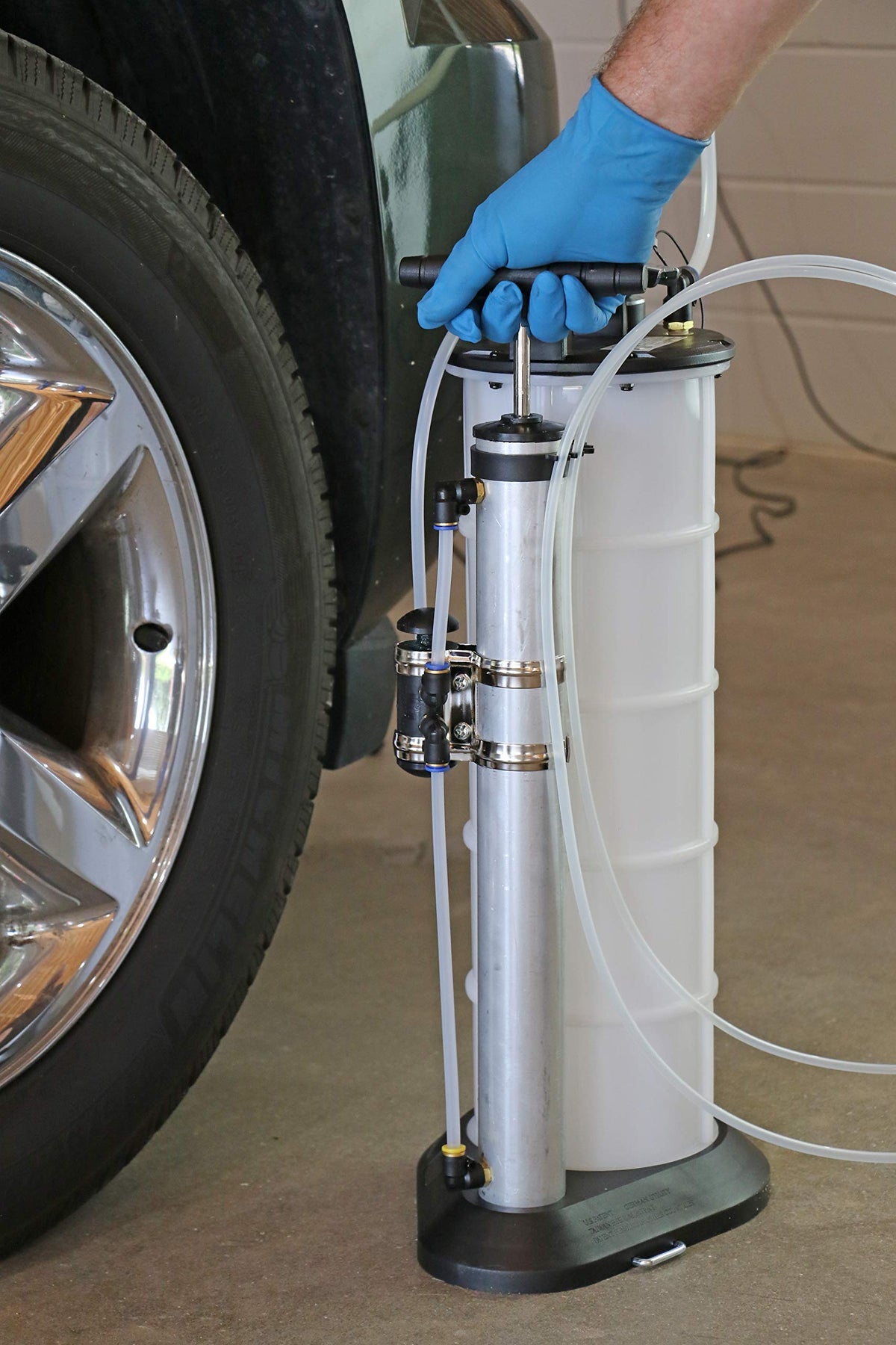 Mityvac pouring in use from spout showing clean transfer and reduced mess