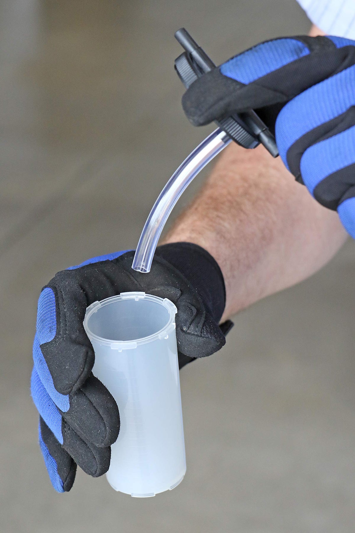 Mityvac pump attached to brake bleeder in use for one-person bleeding convenience