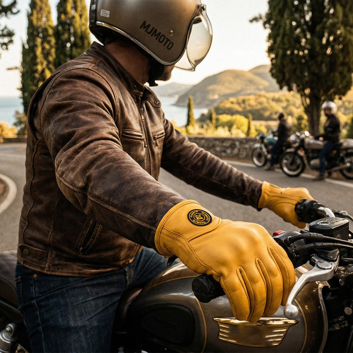 mjmoto gloves beside helmet illustrating scale and riding setup