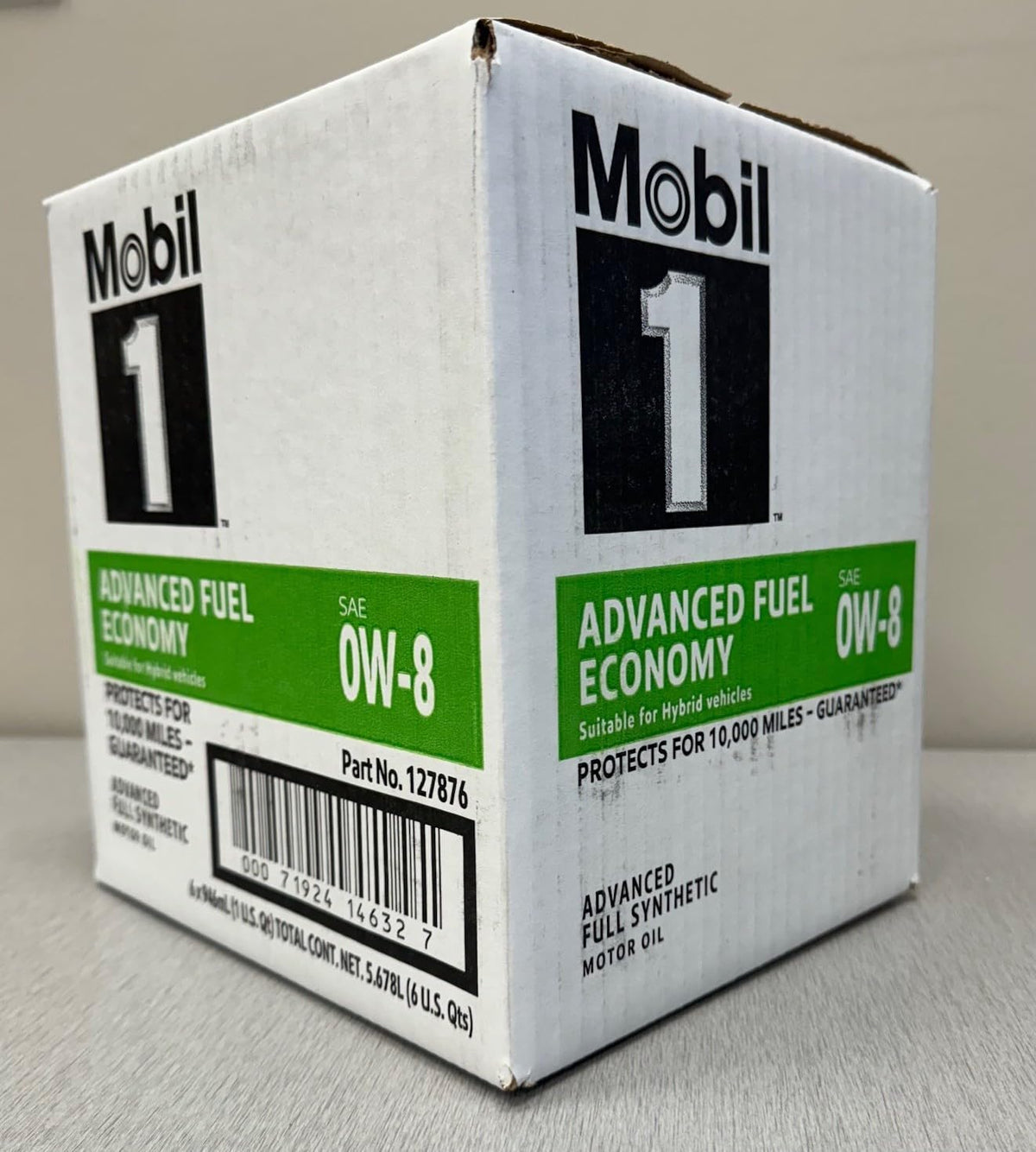 Mobil 1 beside a hybrid vehicle on road highlighting fuel-efficiency benefits