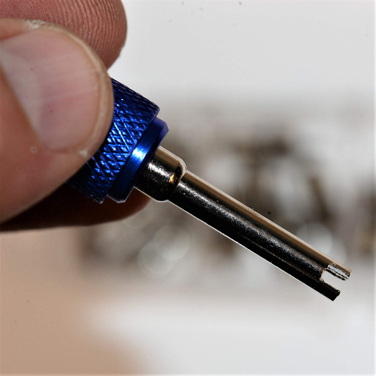Mobling valve core installed in tire stem demonstrating cross-use for inflation repairs