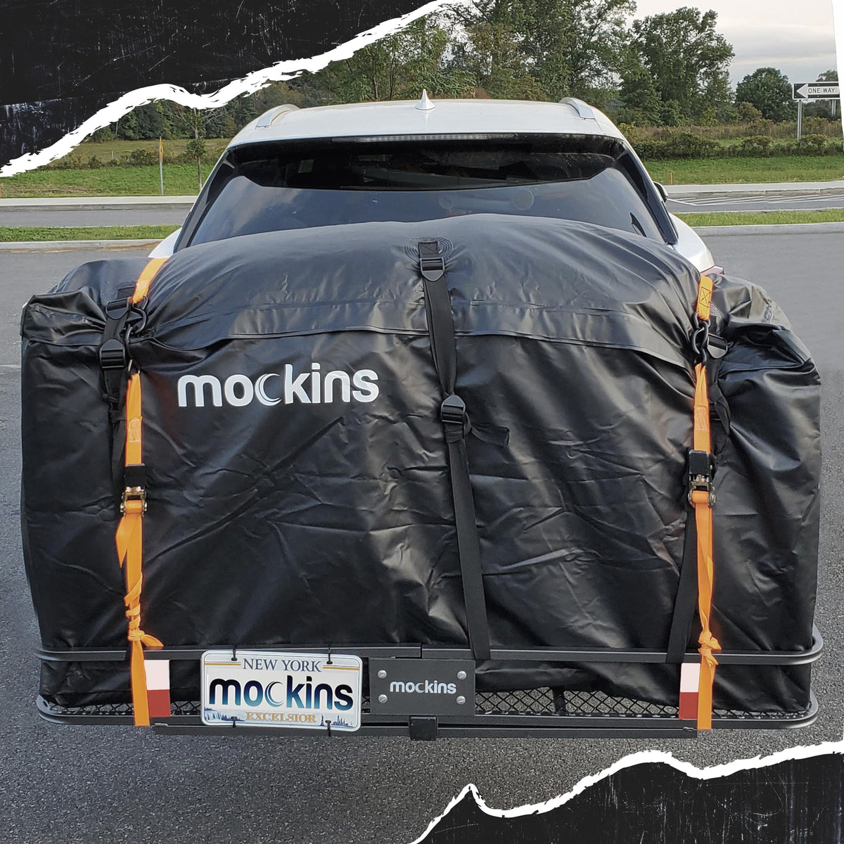 Mockins mounted on hitch carrier keeping gear dry while traveling