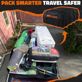 Mockins rooftop bag open and packed with suitcases for organized travel