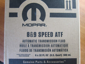 Mopar bottle beside measuring jug showing volume and capacity reference benefit