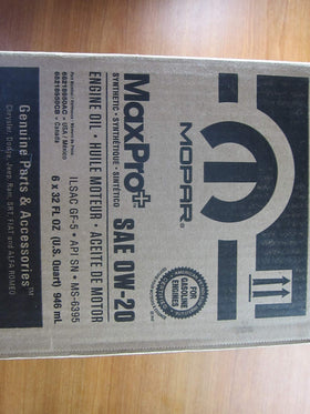 Mechanic using Mopar MaxPro in garage demonstrating reliable vehicle maintenance