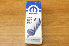Mopar oil filter held in hand to show size and easy DIY handling benefit