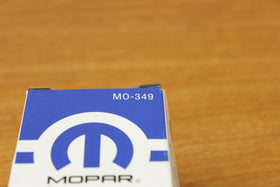 Mopar oil filter installed under hood demonstrating proper OEM compatibility