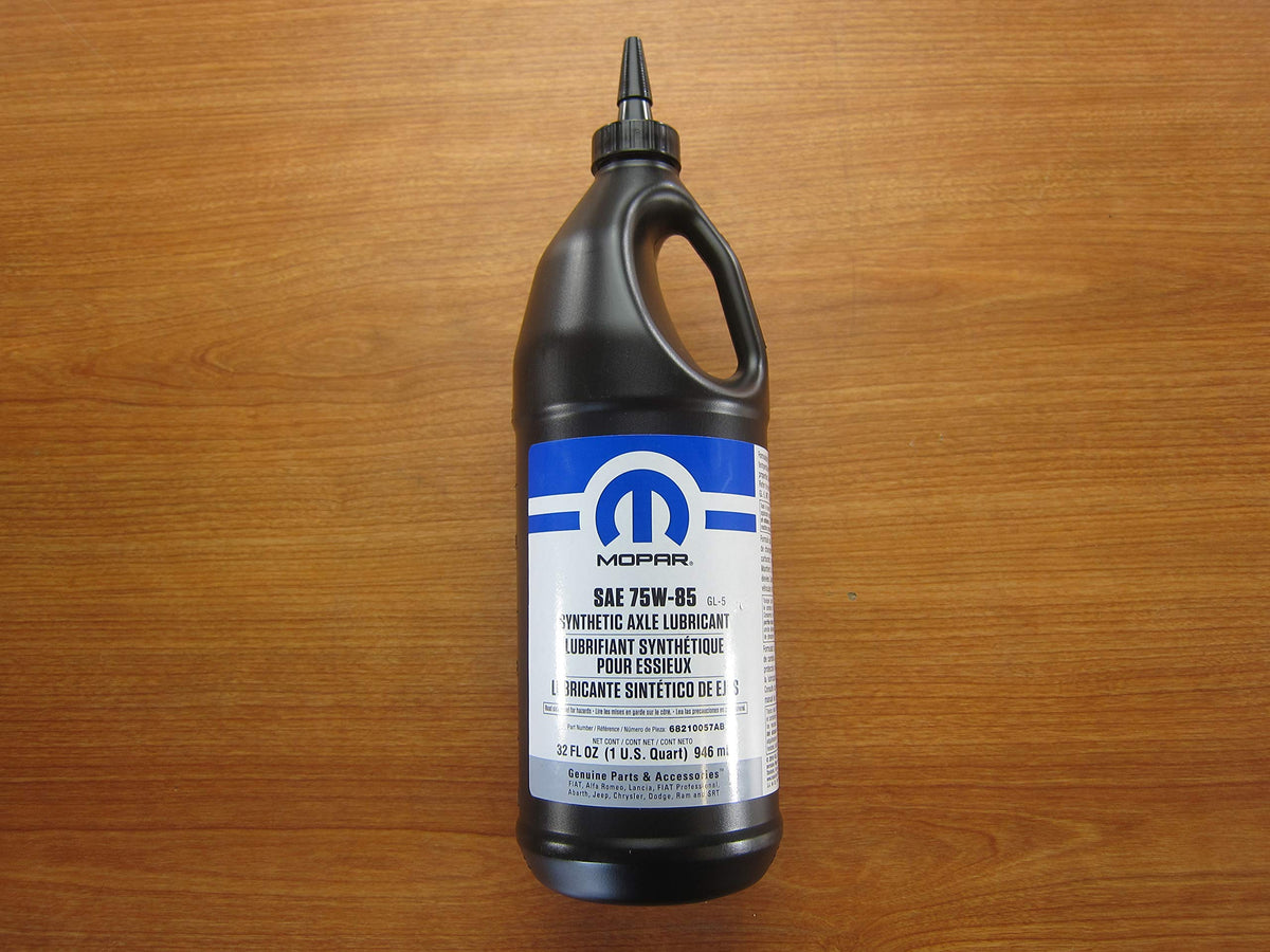 Mopar bottle pouring gear oil into differential with clean funnel for precise, mess-free service