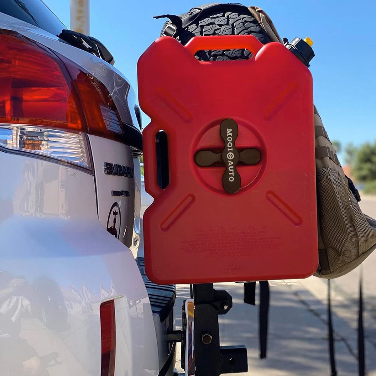 MOQIauto RX-PM next to gas pack showing compatible size and secure fit