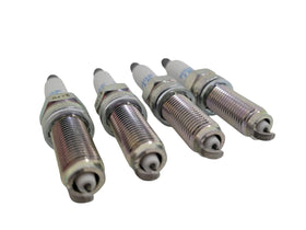 MOROTUS set of four spark plugs laid out for complete cylinder replacement benefit