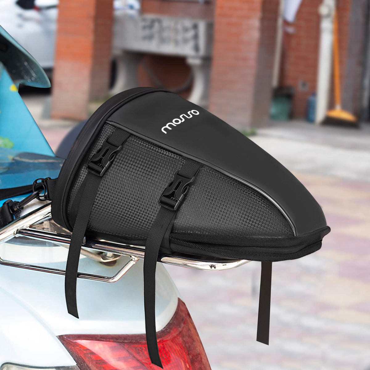 MOSISO carried by hand showing adjustable strap and easy portability